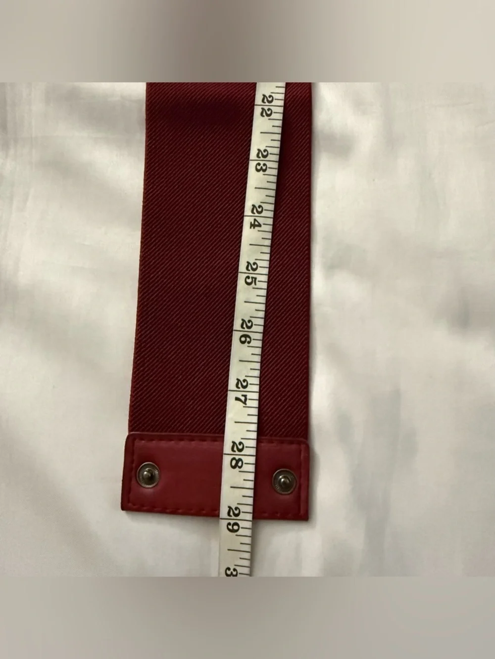 Burgundy elastic waistband belt with brass tone details